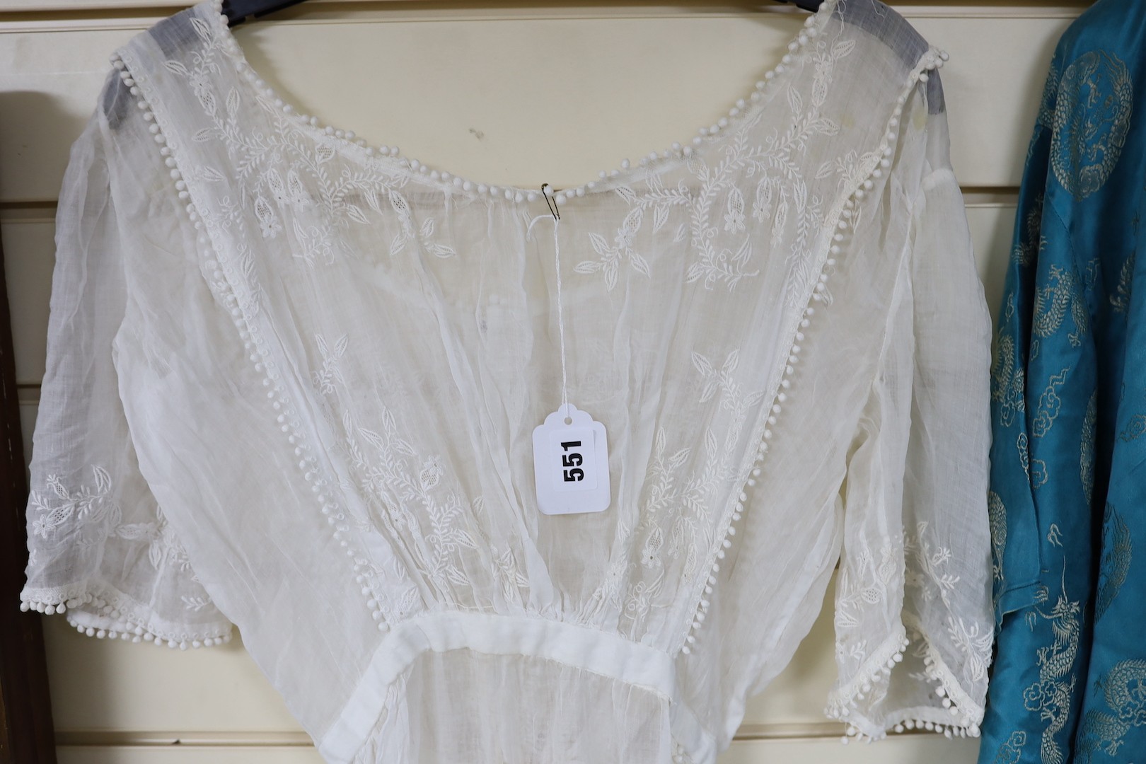 A late 19th early / 20th century fine muslin ladies summer dress, with a white worked bodice trimmed with fine bobbling edge and side slit